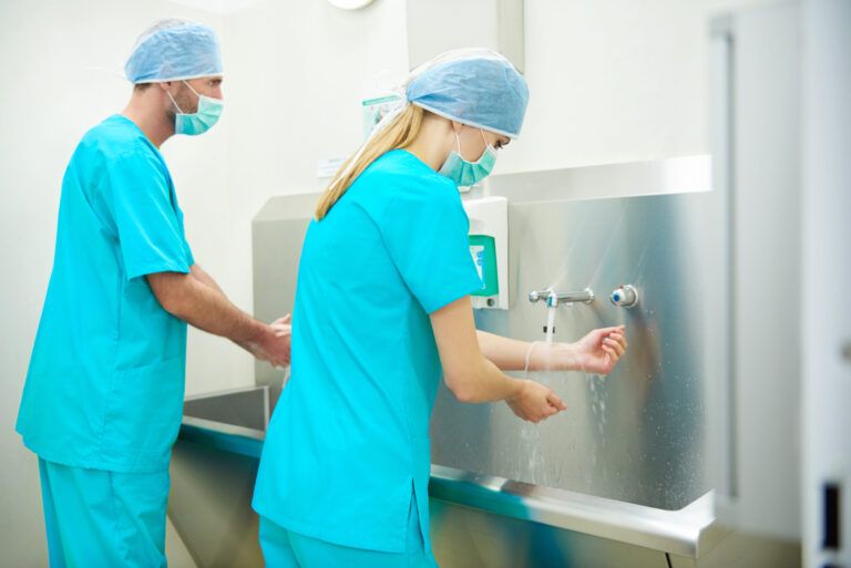 two surgeons washing their hands scaled 1