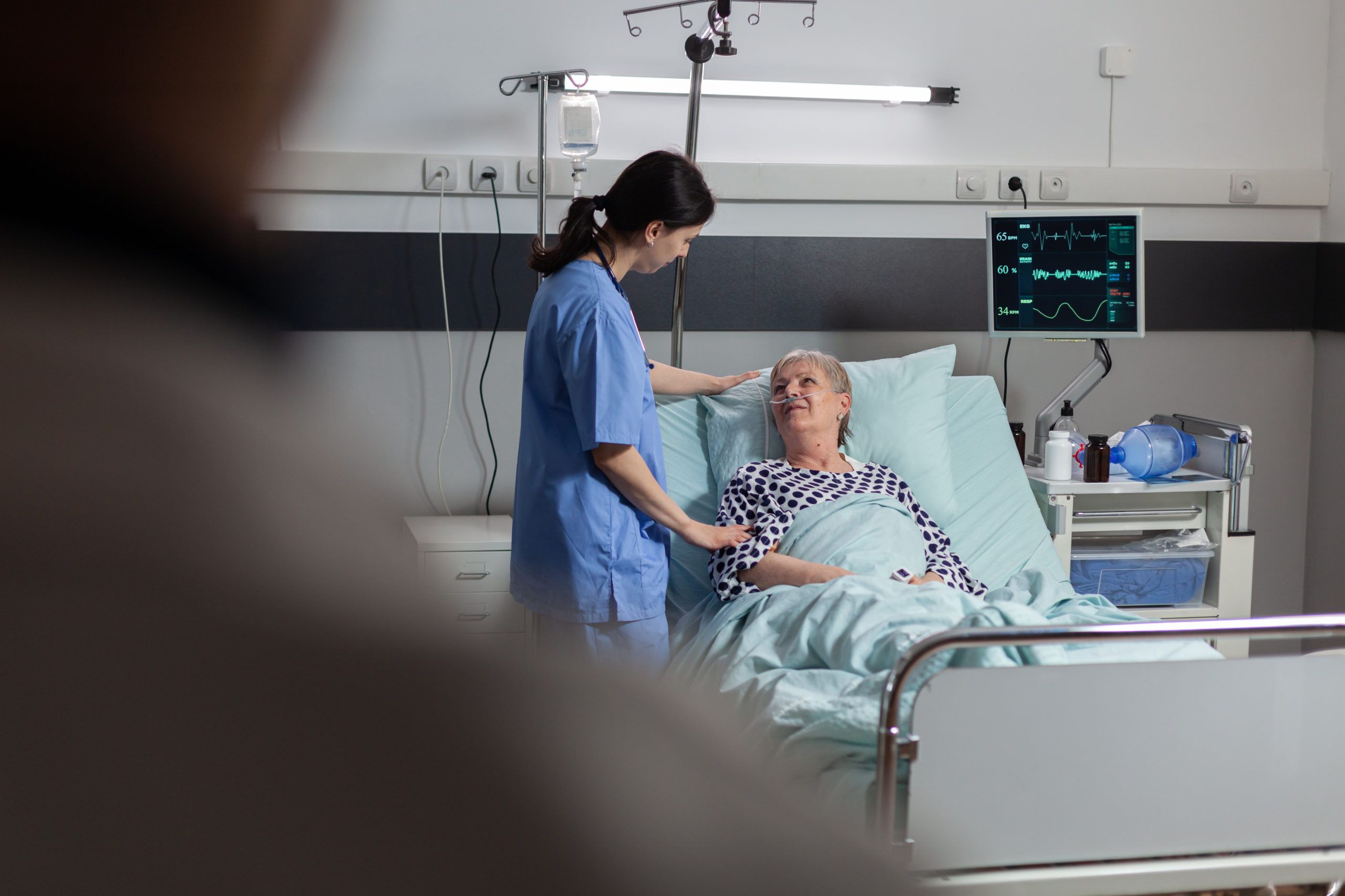 fiendly doctor hands holding patient hand in hospital room giving encouragement empathy support during medical examination scaled 1